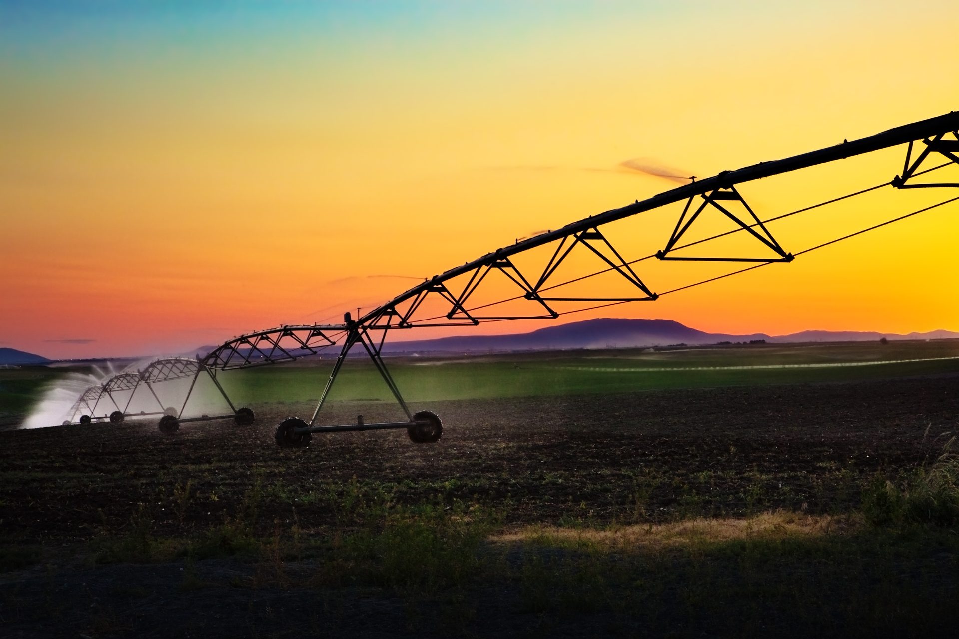 Lateral irrigator over a paddock at sunset