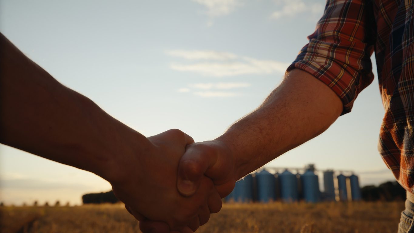 Handshake between grower and buyer at the farm gate